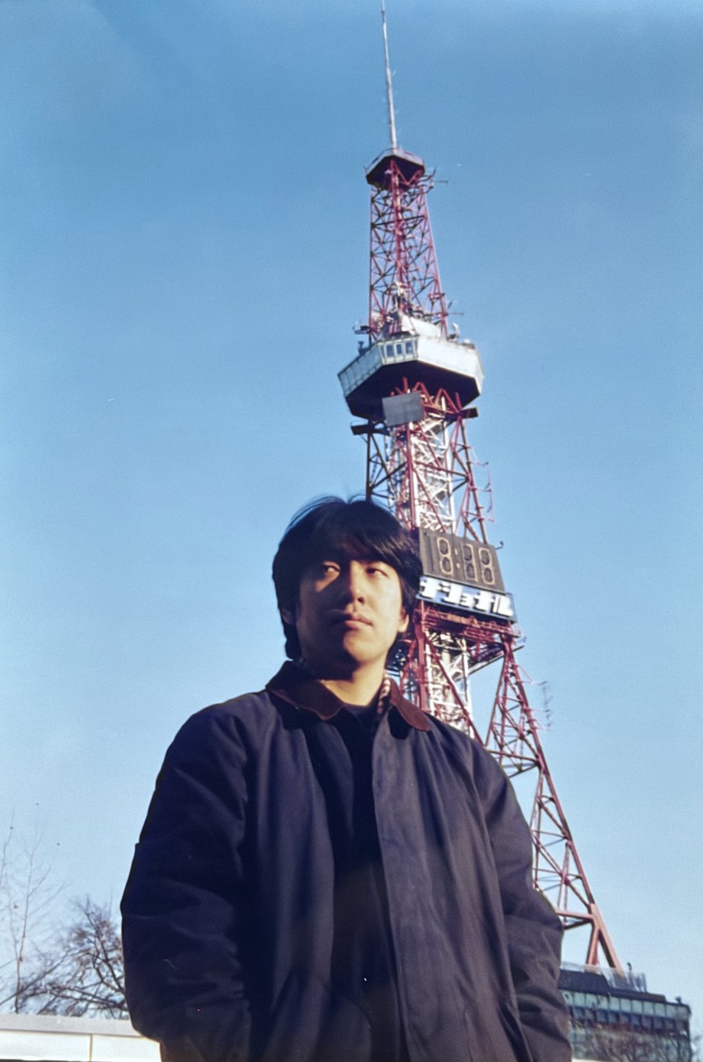 Young January M Itzki in front of the Sapporo TV Tower
