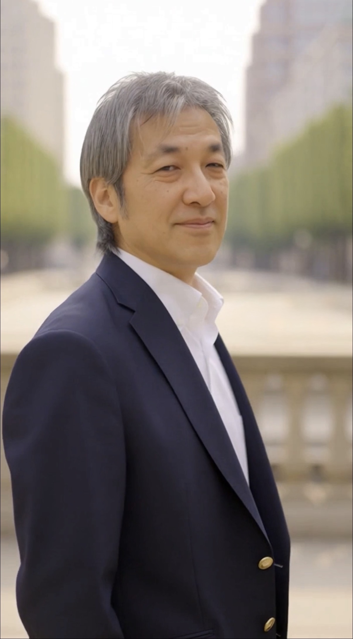 January M Itzki outdoors wearing a navy blazer and white shirt